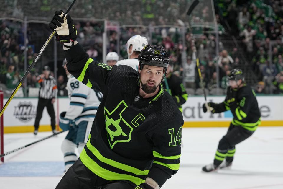 Dallas Stars left wing Jamie Benn (14) celebrates scoring against the San Jose Sharks in the first period of an NHL hockey game in Dallas, Friday, Nov. 11, 2022. (AP Photo/Tony Gutierrez)