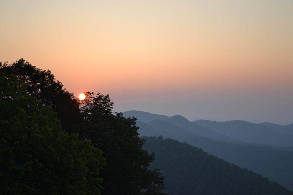 Sunset at Mills River Overlook along the Blue Ridge Parkway. Get Outside WNC offers guided social hikes for all ages and abilities to encourage a love for the outdoors and teach the importance of conservation.