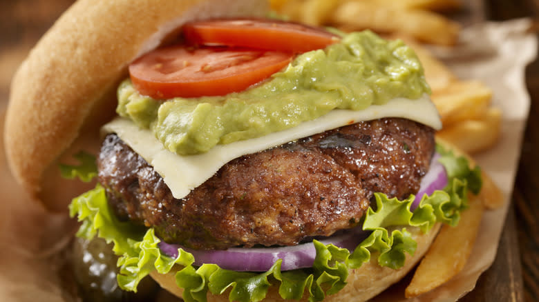 Closeup of guacamole on a burger