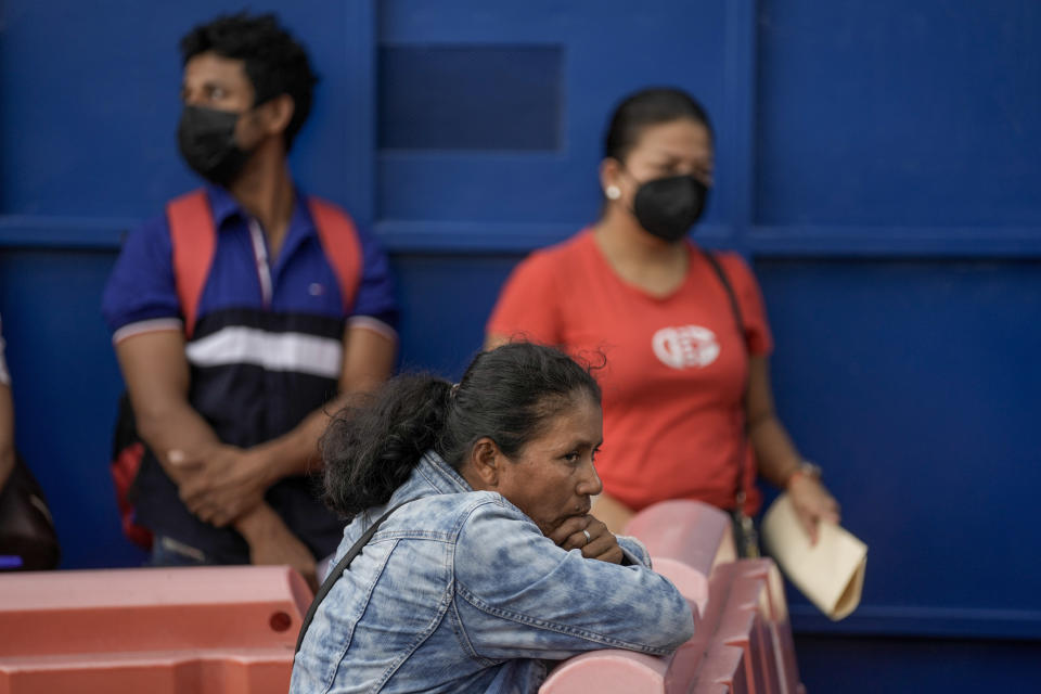 Nicaraguans wait for their first interviews in their application for asylum outside the Refugee Service Center in San Jose, Costa Rica, Monday, Aug. 29, 2022. The exodus of Nicaraguans fleeing political repression has neighboring Costa Rica’s asylum system teetering under the weight of applications that exceed even the 1980s when civil wars ravaged Central America. (AP Photo/Moises Castillo)