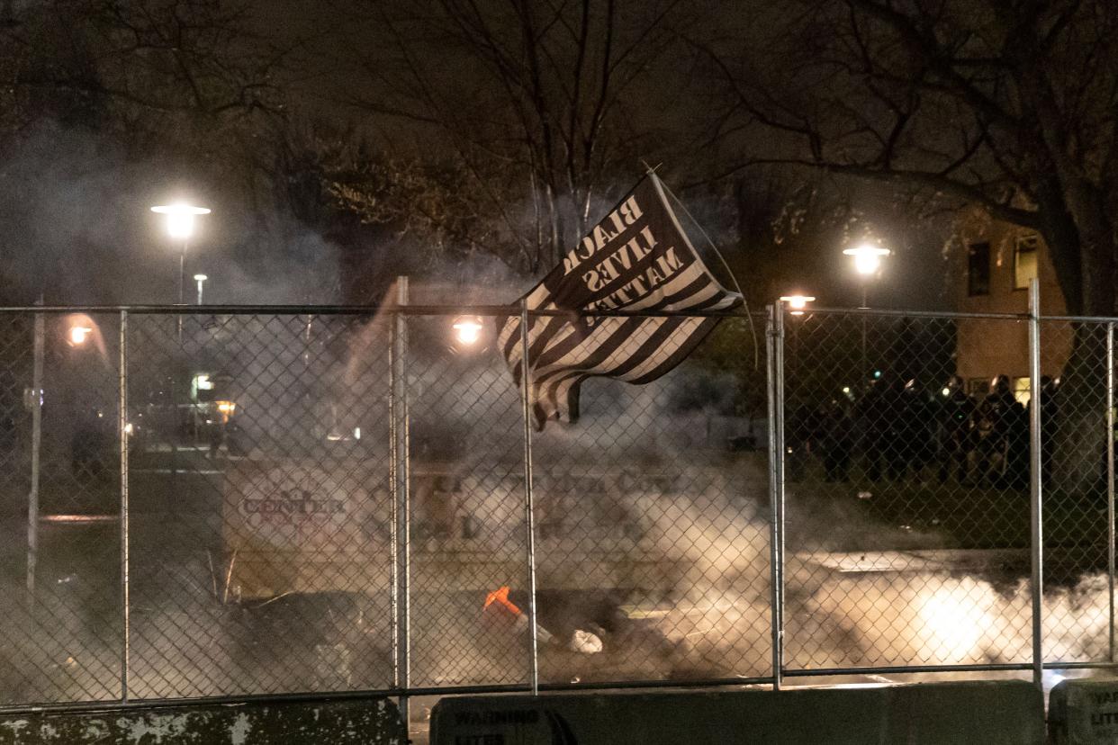 A Black Lives Matter flag is seen after curfew as demonstrators protest the death of Daunte Wright who was shot and killed by a police officer in Brooklyn Center, Minnesota on April 12. 