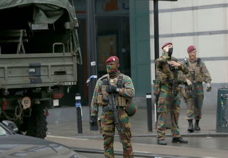 Belgian soldiers take up position outside the City2 shopping complex which was evacuated following a bomb scare in Brussels, Belgium, June 21, 2016. REUTERS/Francois Lenoir