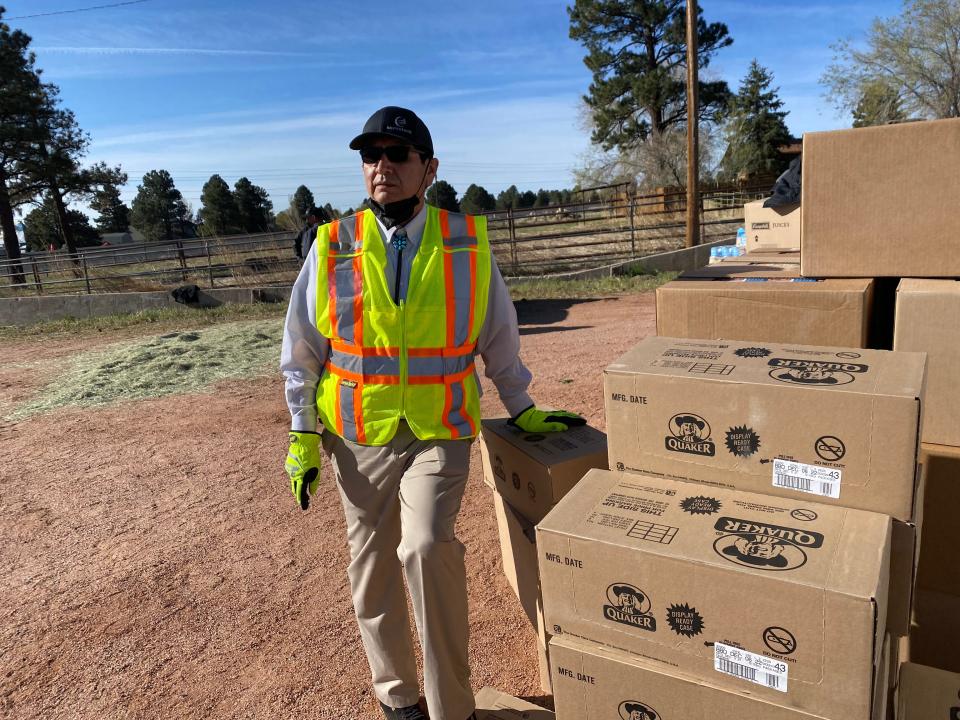 Navajo Nation President Jonathan Nez assists with the distribution for Tunnel Fire evacuees at the Horsemen Lodge in Flagstaff, April 23, 2022.