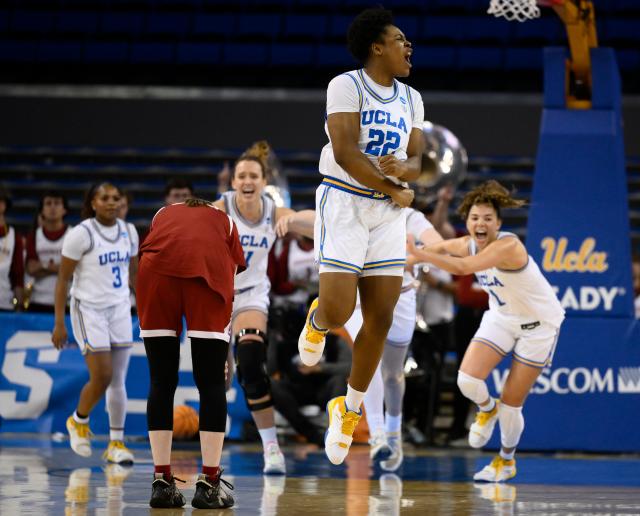 Mar 20, 2023; Los Angeles, CA, USA; UCLA Bruins center Christeen Iwuala (22) and teammates celebrate beating the Oklahoma Sooners in an NCAA Tournament Women’s 2nd Round dd game at Pauley Pavilion. Mandatory Credit: Robert Hanashiro-USA TODAY Sports