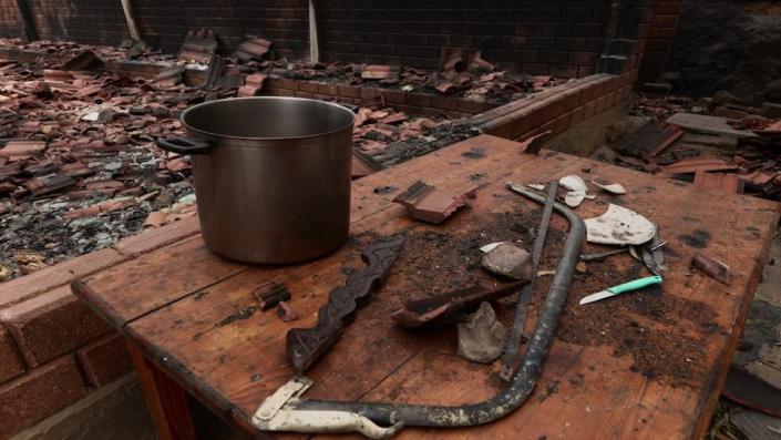A saucepan can be seen among the remains of El Selmi&#39;s burnt up restaurant