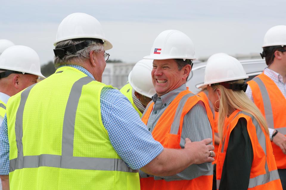 Governor Brian Kemp is greeted as he arrives at the Bryan County Mega Site, the future home of the Hyundai Meta Plant, on Friday in Ellabell.