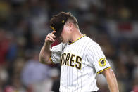 San Diego Padres relief pitcher Mark Melancon reacts after being removed in the ninth inning of the team's baseball game against the Cincinnati Reds on Thursday, June 17, 2021, in San Diego. (AP Photo/Derrick Tuskan)