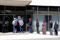 Members of Guatemalan Maya families, who feared their relatives were among 19 bodies found shot and burnt at the weekend in a remote part of northern Mexico, arrive at the Faculty of Medicine for DNA samples to help in the identification, in Guatemala City