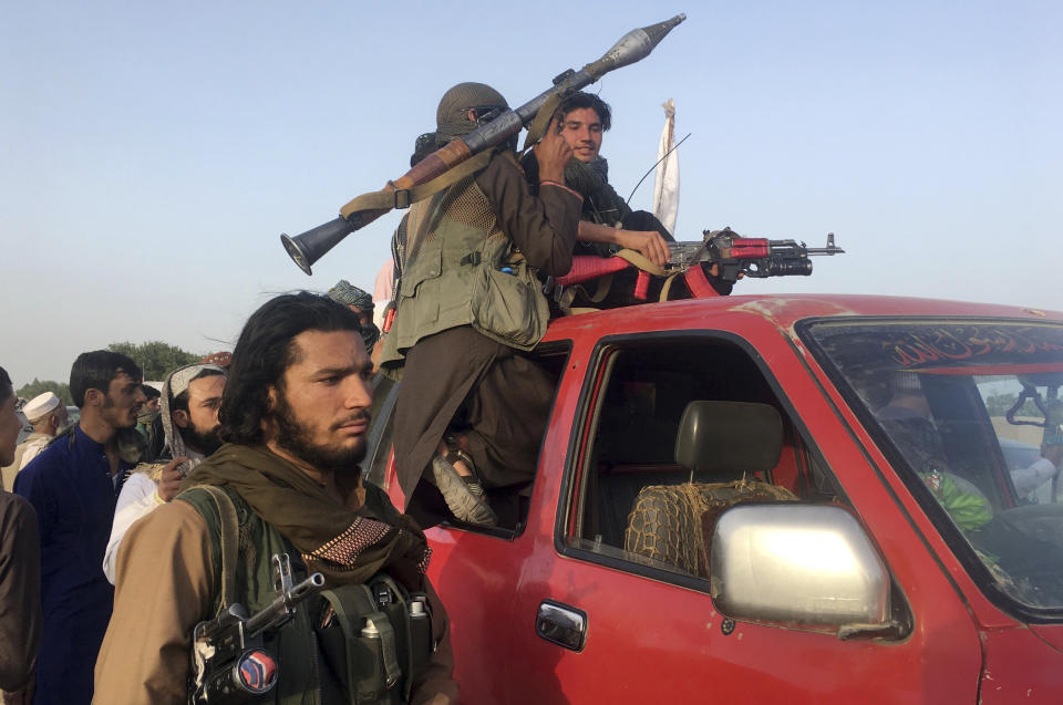 FILE- In this June 16, 2018, file photo, Taliban fighters ride in their vehicle in Surkhroad district of Nangarhar province, east of Kabul, Afghanistan. In a rare diplomatic foray and the strongest sign yet of the Taliban's increasing political presence in the region, the head of the militant group's political office led a delegation to Uzbekistan to meet senior Foreign Ministry officials, Uzbek and Taliban officials said Saturday, Aug. 11, 2018. (AP Photo/Rahmat Gal, file)