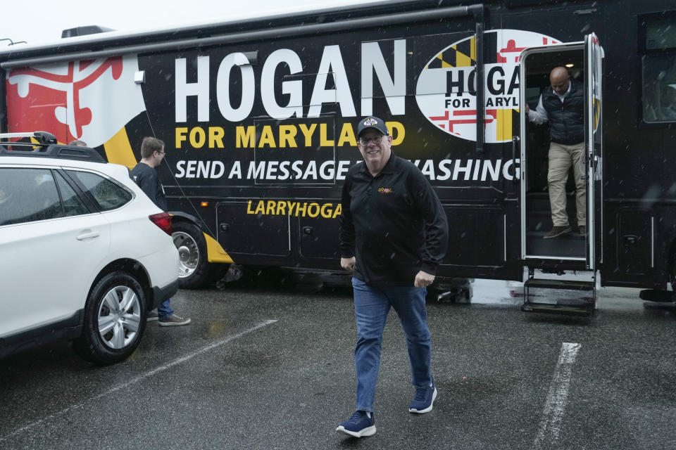 Former Maryland Gov. Larry Hogan steps off of his campaign bus for a stop at DePaola's Bagel and Brunch in Stevensville, Md., Friday, April 12, 2024, as he campaigns for the U.S. Senate. (AP Photo/Susan Walsh)