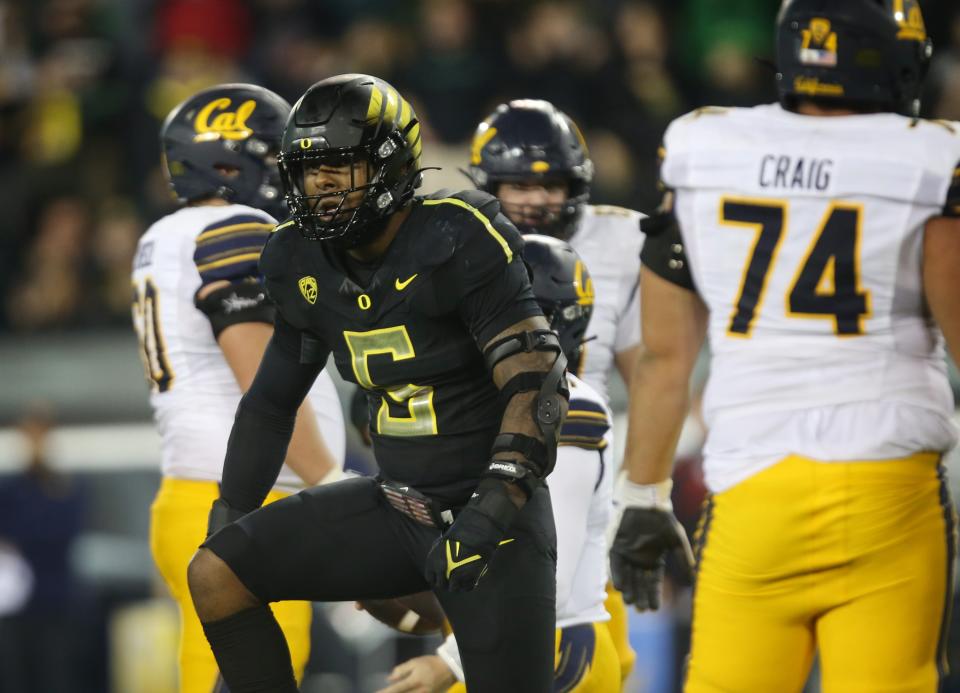 Oregon defensive end Kayvon Thibodeaux celebrates a stop against California, Oct. 15, 2021.