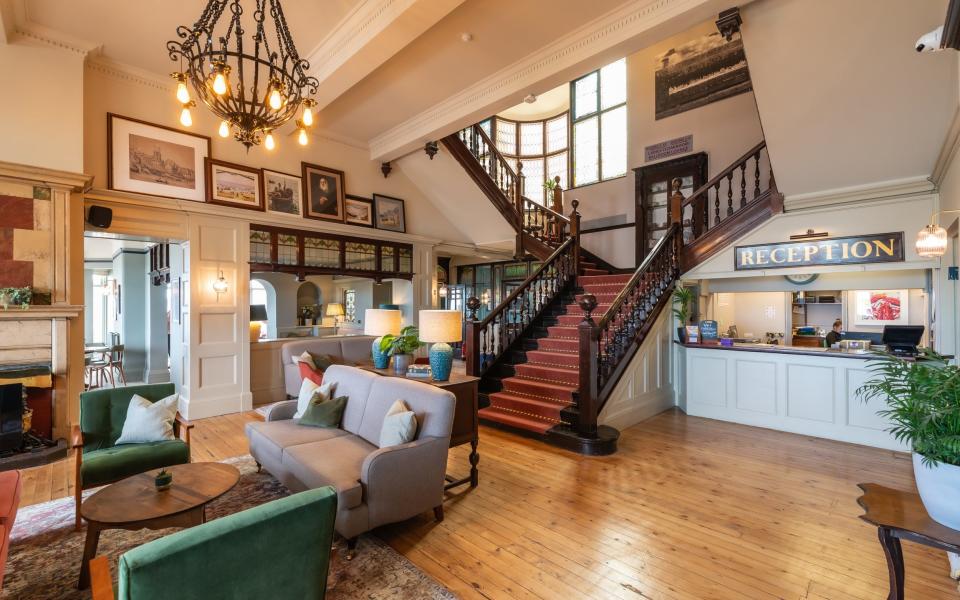  ‘Glorious bones’: the main sweeping staircase frames the old-school reception desk, where ‘keys are nostalgically hung from a board’ 