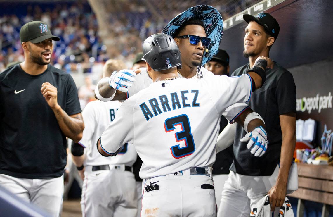 Miami Marlins designated hitter Jorge Soler (12) hugs second baseman Luis Arraez (3) after hitting a home run against the Toronto Blue Jays in the third inning of an MLB game at loanDepot park on Monday, June 19, 2023, in Miami, Fla.