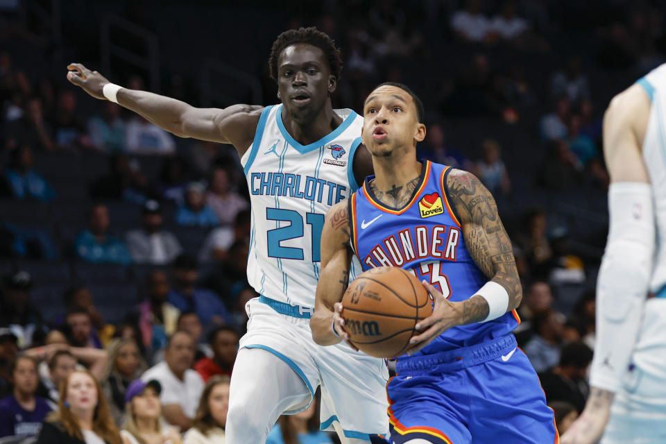 Oct 15, 2023; Charlotte, North Carolina, USA; Oklahoma City Thunder guard Tre Mann (23) drives to the basket past Charlotte Hornets guard <a class="link " href="https://sports.yahoo.com/nba/players/5821" data-i13n="sec:content-canvas;subsec:anchor_text;elm:context_link" data-ylk="slk:Frank Ntilikina;sec:content-canvas;subsec:anchor_text;elm:context_link;itc:0">Frank Ntilikina</a> (21) in the first half at Spectrum Center. Mandatory Credit: Nell Redmond-USA TODAY Sports