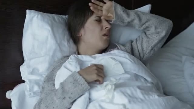 Woman in bed sick