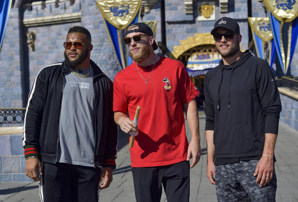 Los Angeles Rams' Aaron Donald, left, NFL football's Super Bowl 56 MVP Cooper Kupp, center, and Matthew Stafford, right, answer questions during a media Q&A at Disneyland in Anaheim, Calif., Monday, Feb. 14, 2022. The Rams defeated the Cincinnati Bengals in the Super Bowl on Sunday. (Jeff Gritchen/The Orange County Register via AP)