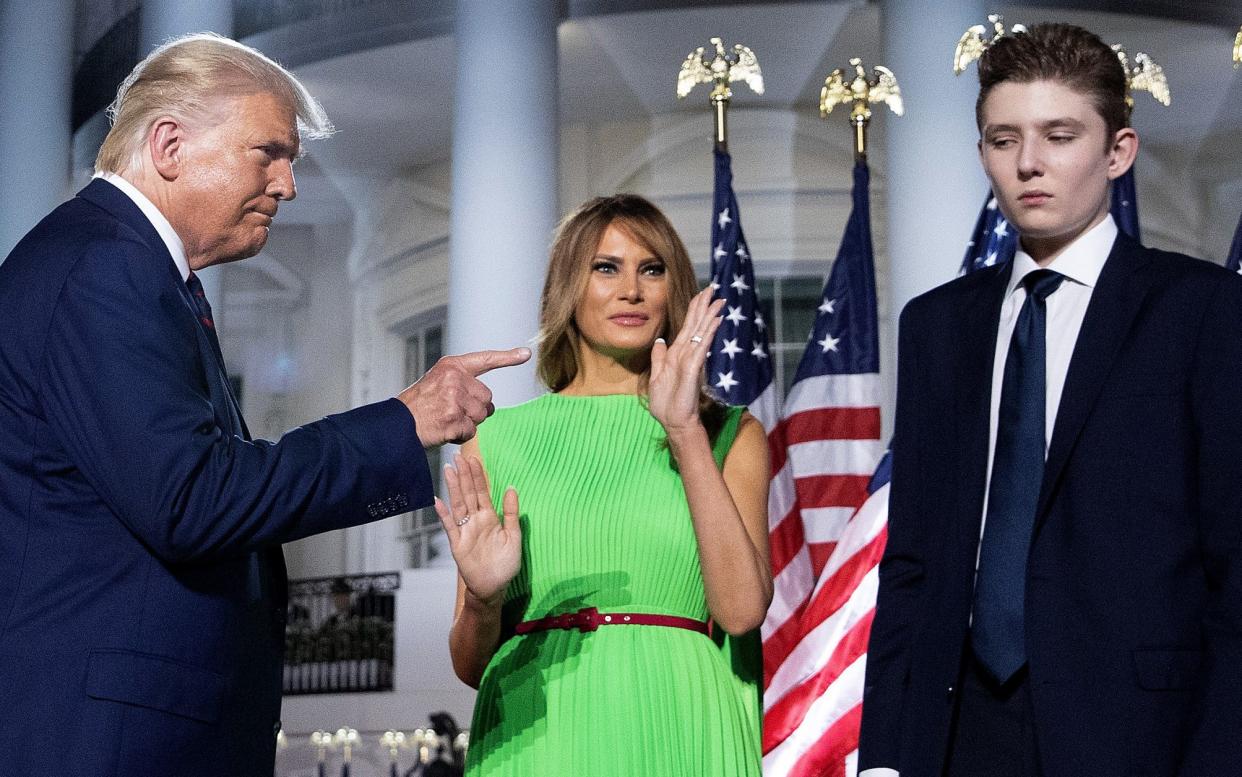 From left to right: Donald Trump, Melania Trump and Barron Trump, pictured at the White House in August 2020