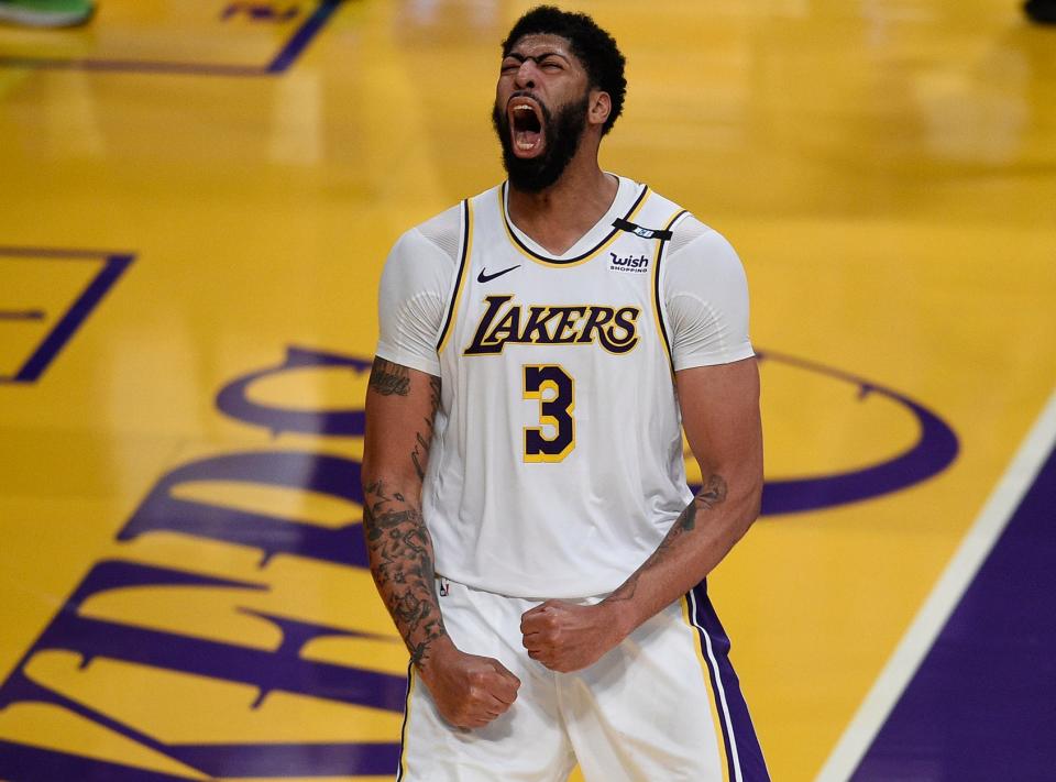 Los Angeles Lakers forward Anthony Davis reacts after a dunk during the second half against the Phoenix Suns at Staples Center on May 9, 2021. 