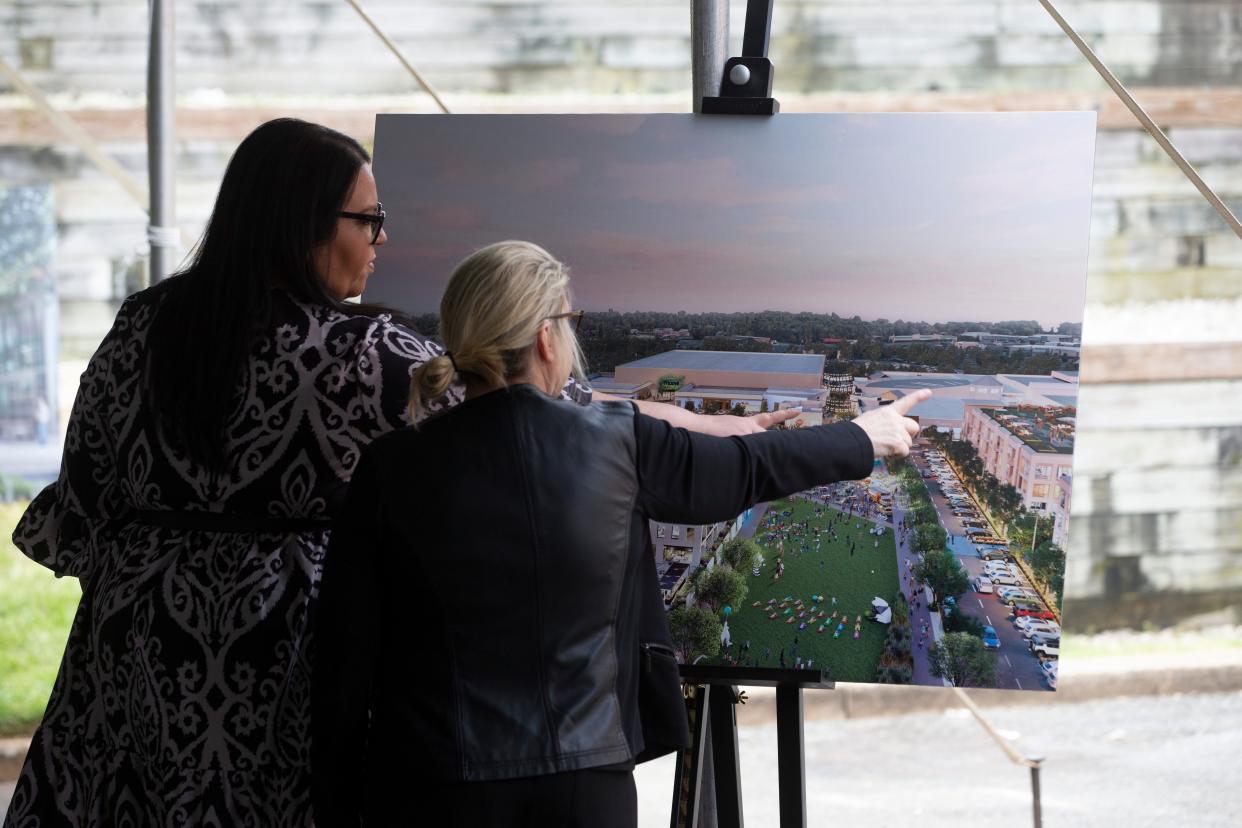 Guests look over a rendering of the future Monmouth Square at a groundbreaking to replace Monmouth Mall in Eatontown. Owner Kushner Cos. will redevelop the mall into a modern, open air facility with 900,000 square feet of retail and restaurant space, a public green, pedestrian pathways, 1,000 residential units, and medical office space. 
Eatontown, NJ
Thursday, May 9, 2024