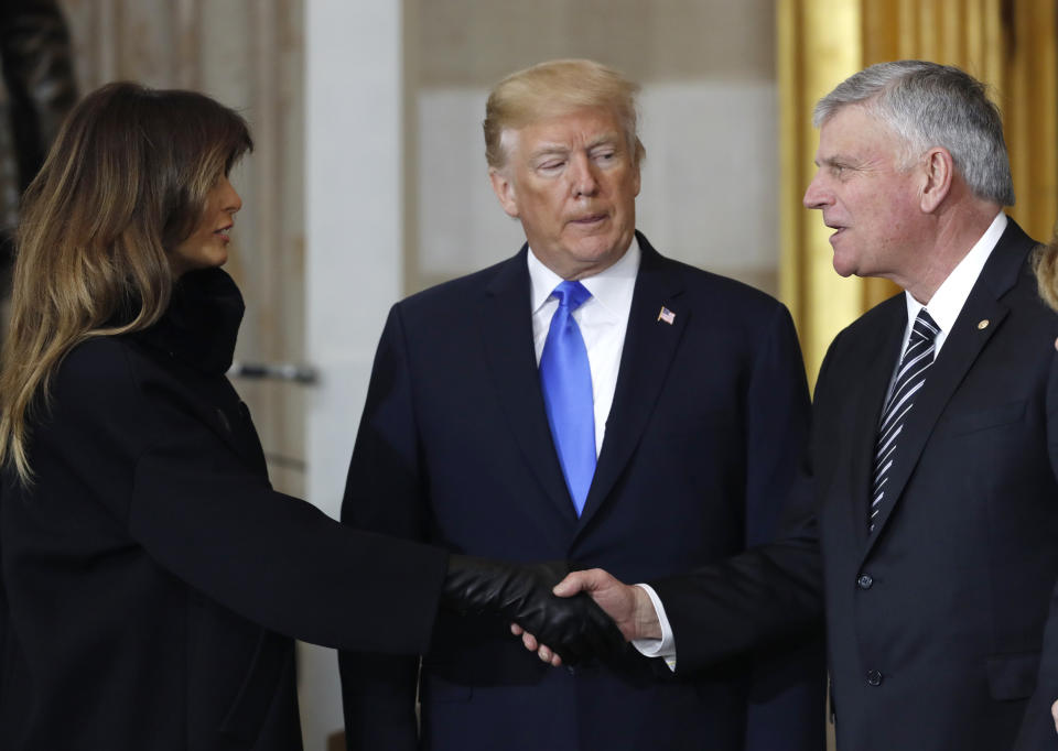 <p>First lady Melania Trump shakes hands with the Rev Bill Graham’s son Franklin Graham as President Donald Trump looks on during ceremonies in the U.S. Capitol Rotunda as the remains of the late Rev. Billy Graham lie in honor in Washington, Feb. 28, 2018. (Photo: Jonathan Ernst/Reuters) </p>