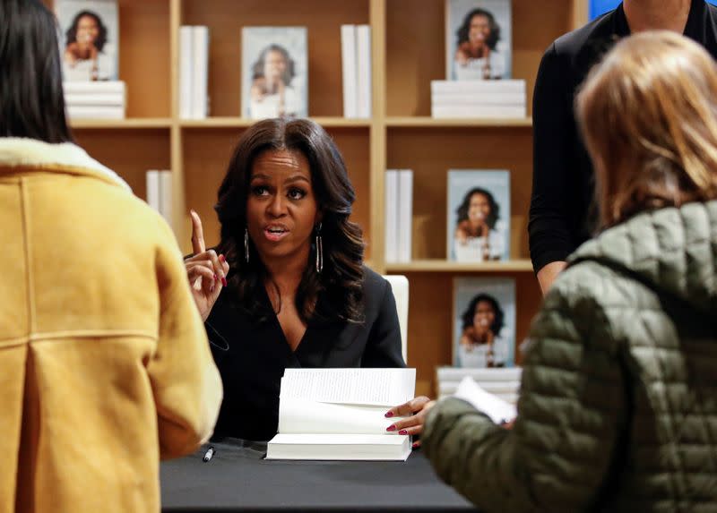 FILE PHOTO: Former first lady Michelle Obama signs copies of her memoir Becoming in Chicago