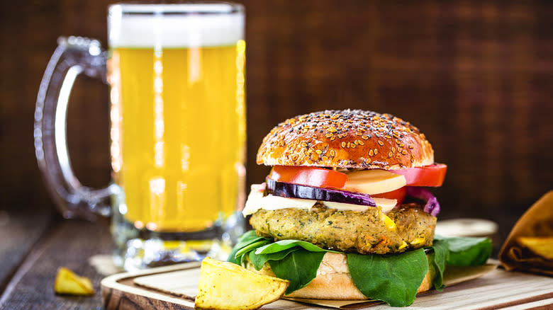 Veggie burger on board with beer