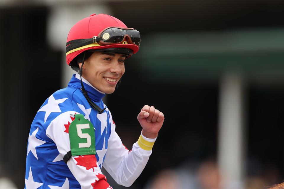 Jockey Jose Ortiz pumps his fist in the winner circle after riding Jack Christopher home to win the Pat Day Mile at Churchill Downs on Kentucky Derby Day on May 7, 2022.