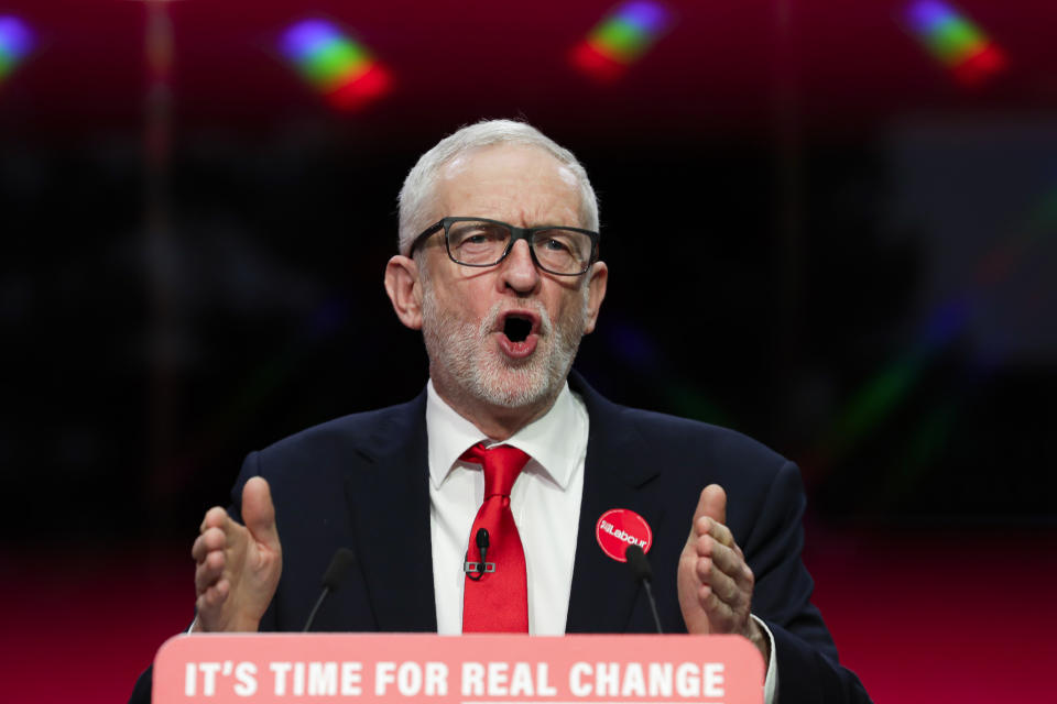 Jeremy Corbyn, Leader of Britain's opposition Labour Party, speaks on stage at the launch of Labour's General Election manifesto, at Birmingham City University, England, Thursday, Nov. 21, 2019. Britain goes to the polls on Dec. 12. (AP Photo/Kirsty Wigglesworth)