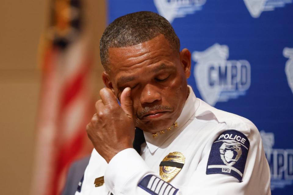 Police Chief Johnny Jennings wipes away tears as he speaks at a press conference on Tuesday (AP)