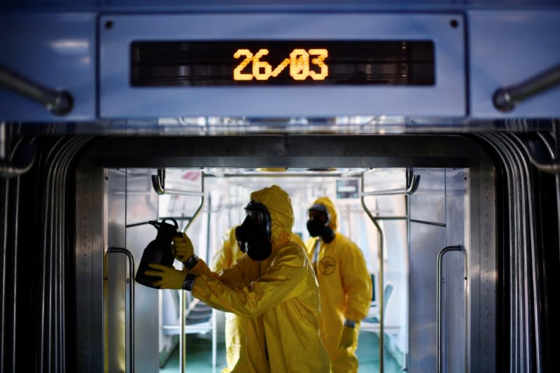 Members of the armed forces disinfect a train car during the coronavirus disease (COVID-19) outbreak, at the Brazil's Central station in Rio de Janeiro