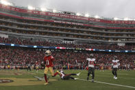 San Francisco 49ers wide receiver Brandon Aiyuk (11) runs into the end zone after scoring a touchdown against the Tampa Bay Buccaneers during the first half of an NFL football game in Santa Clara, Calif., Sunday, Dec. 11, 2022. (AP Photo/Jed Jacobsohn)