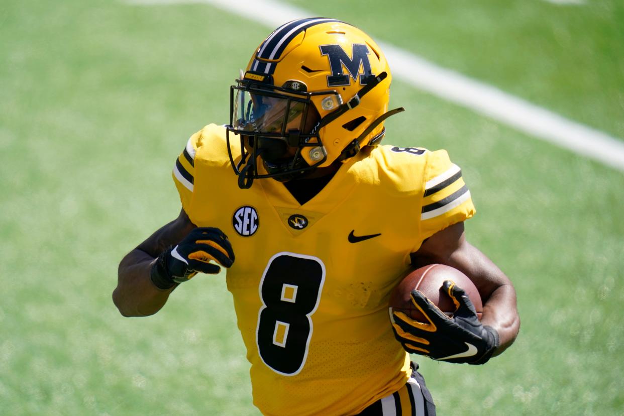 Missouri running back Nathaniel Peat runs with the ball during the Tigers' spring game March 19.