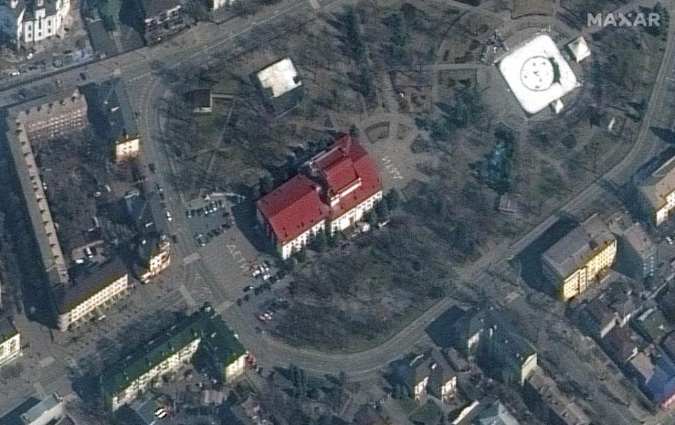 A satellite image of the Donetsk Regional Theatre of Drama, taken days before the bombing, shows the Russian word for ‘children’ written in large white letters in front of and behind the building (Maxar Technologies)