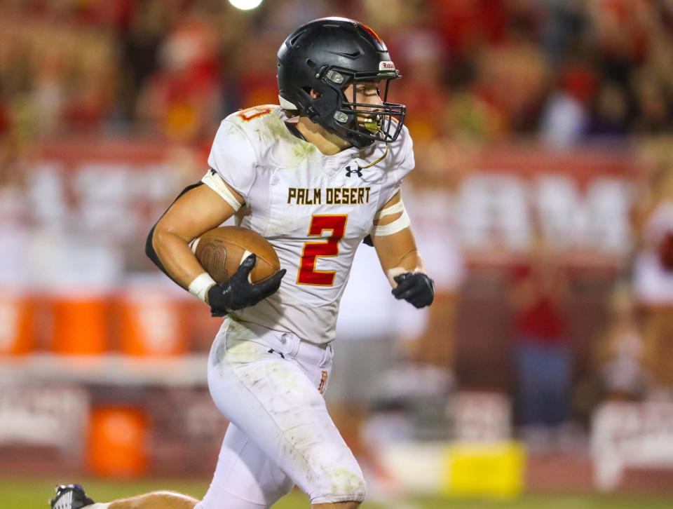 Palm Desert's Dawson Johnson (2) runs the ball during the third quarter of their game at La Quinta High School in La Quinta, Calif., Friday, Sept. 30, 2022. 