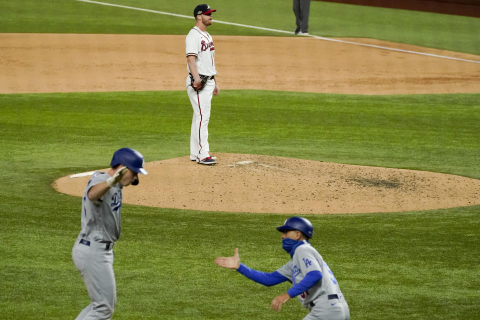 Los Angeles Dodgers' Will Smith (16) celebrates a three-run home run off Atlanta Braves relief pitcher Will Smith during the sixth inning in Game 5 of a baseball National League Championship Series Friday, Oct. 16, 2020, in Arlington, Texas. (AP Photo/Tony Gutierrez)