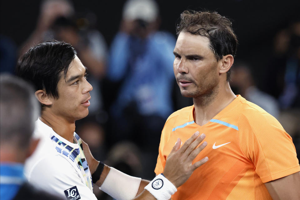 Rafael Nadal, right, of Spain congratulates Mackenzie McDonald of the U.S., following their second round match at the Australian Open tennis championship in Melbourne, Australia, Wednesday, Jan. 18, 2023. (AP Photo/Asanka Brendon Ratnayake)