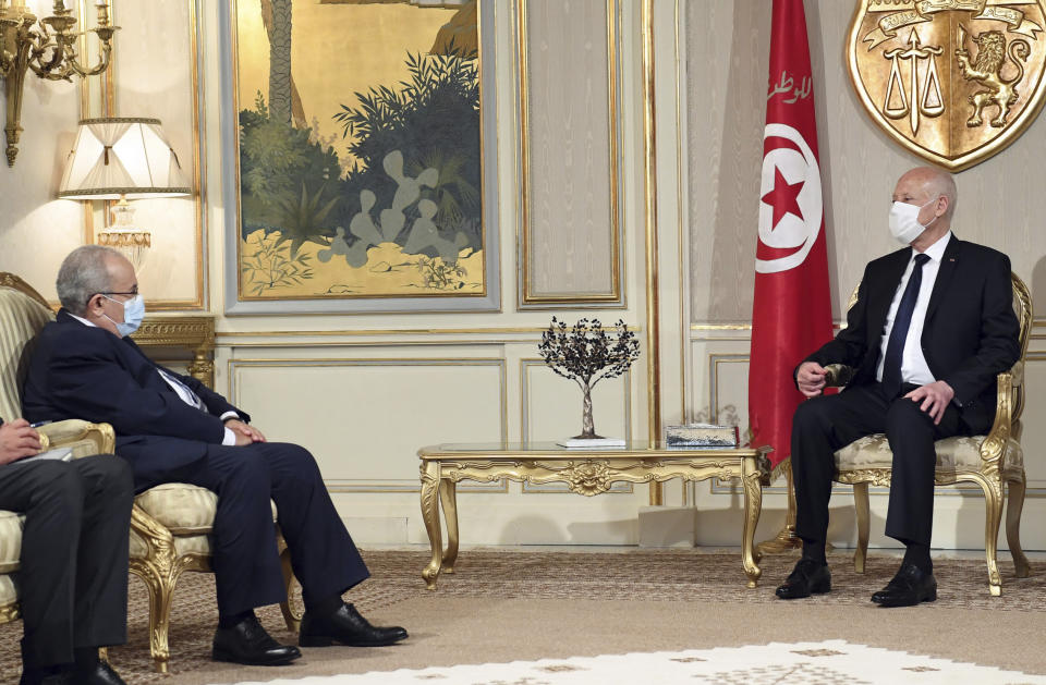 Algerian Foreign Minister Ramadhan Laamamra, left, meets Tunisian President Kais Saeid, to discuss the Tunisian crisis at the Presidential Palace in Carthage, outside Tunis, Tunisia, Tuesday, July 27, 2021. The leader of Tunisia's Islamist party and speaker of parliament said Tuesday that his party is working to form a national front. (AP Photo/Slim Abid)