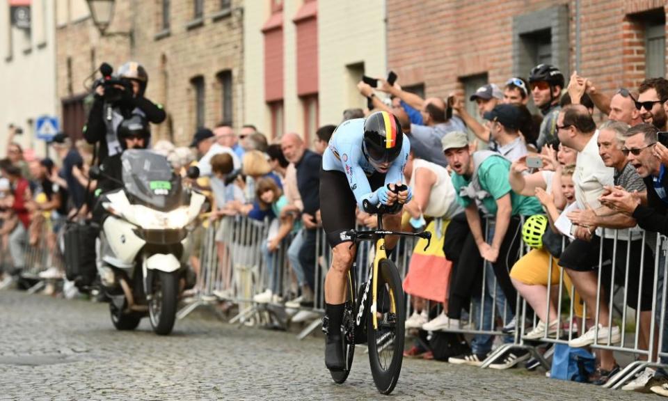 Wout van Aert is cheered on by spectators lining the streets of Bruges.