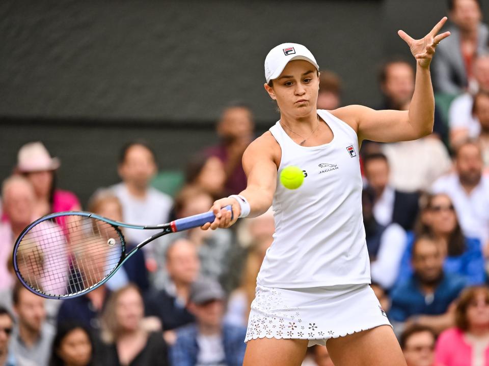 Ashleigh Barty plays tennis during Wimbledon 2021.