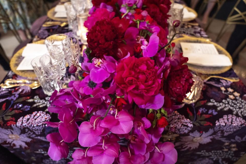 A colorful floral centerpiece is seen atop a sequined table cloth during a preview of the State Dinner with Kenya, Wednesday, May 22, 2024, ahead of Thursday evening's State Dinner with Kenya's President William Ruto, at the White House in Washington. (AP Photo/Jacquelyn Martin)
