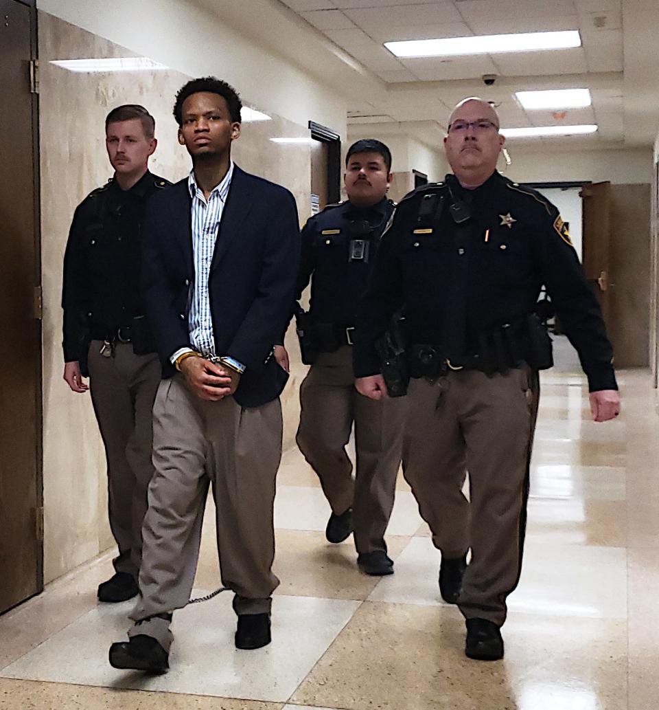 Lubbock County sheriff's deputies escort Larry Pearson out of the 140th District Court on Wednesday, where a jury sentenced him to 70 years in prison after finding him guilty of intimidating a public servant.