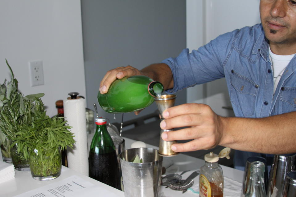 2. Add fresh pineapple juice, fresh lime juice, 2 sage leaves and agave nectar into a cocktail shaker.