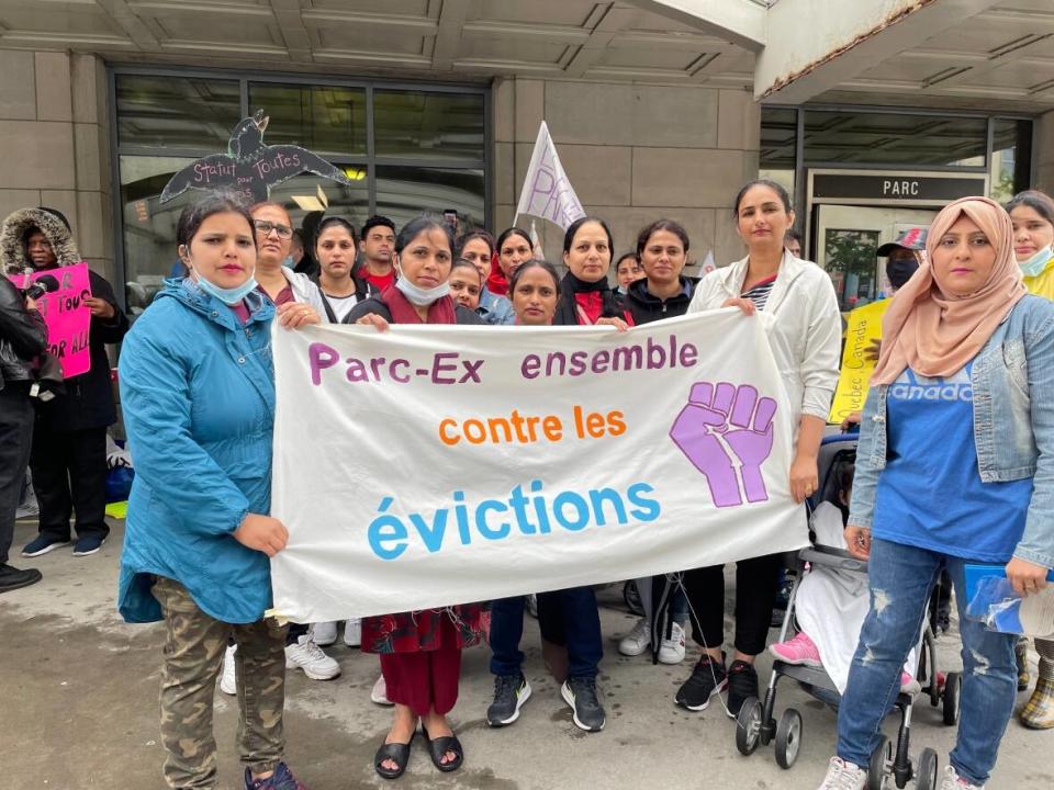 The Comité d'action de Parc Extension who organized a protest outside Parc Metro on Saturday. Many in the neighbourhood who are facing evictions took part.   (Jennifer Yoon/CBC - image credit)