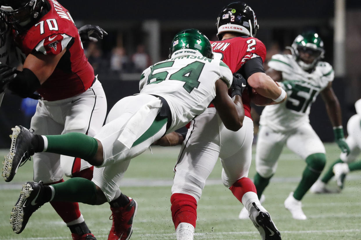 New York Jets inside linebacker Avery Williamson (54) sacks Atlanta Falcons quarterback Matt Ryan (2) during the first half an NFL preseason football game, Thursday, Aug. 15, 2019, in Atlanta. (AP Photo/John Bazemore)