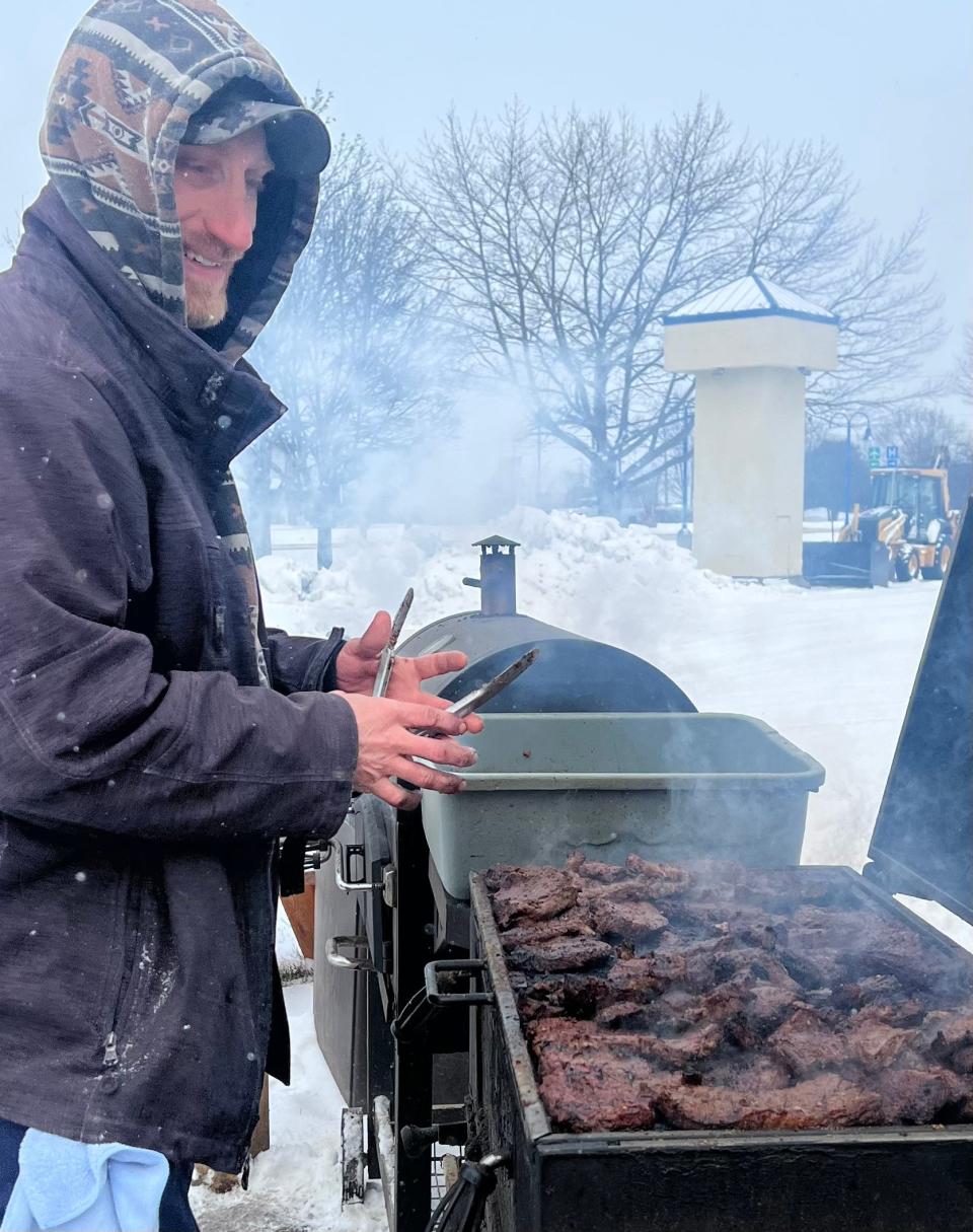 Ryan Bronson smokes chicken at LT's Tacos, where his fiance, Patricia Vasquez, works with her parents.