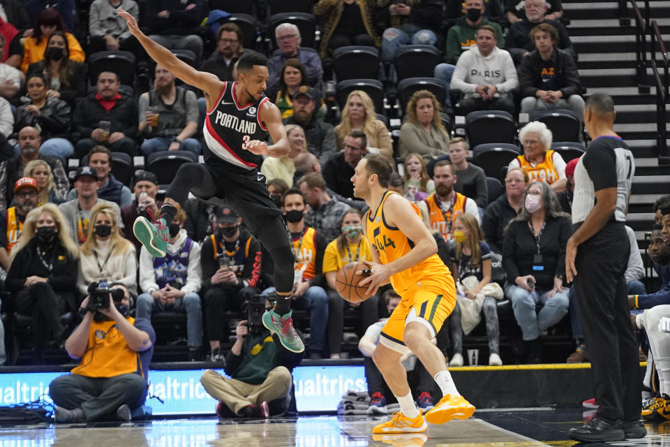 Portland Trail Blazers guard CJ McCollum (3) defends against Utah Jazz forward Bojan Bogdanovic (44) in the first half during an NBA basketball game Monday, Nov. 29, 2021, in Salt Lake City. (AP Photo/Rick Bowmer)