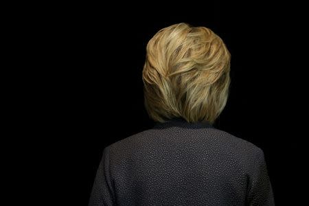 U.S. Democratic presidential candidate Hillary Clinton leaves after speaking at the Black Women's Agenda Annual Symposium in Washington, U.S., September 16, 2016. REUTERS/Carlos Barria