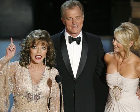 Joan Collins (L), Stephen Collins (C) and Heather Locklear speak during the 58th annual Primetime Emmy Awards at the Shrine Auditorium in Los Angeles August 27, 2006. REUTERS/Mike Blake