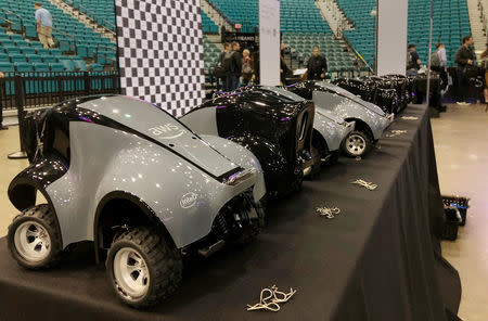 Amazon’s AWS DeepRacer cars line a table at the MGM Grand Garden Arena where the cloud computing company opened temporary race tracks after announcing the new product aimed at web developers, in Las Vegas, Nevada, U.S., November 28, 2018. REUTERS/Jeffrey Dastin