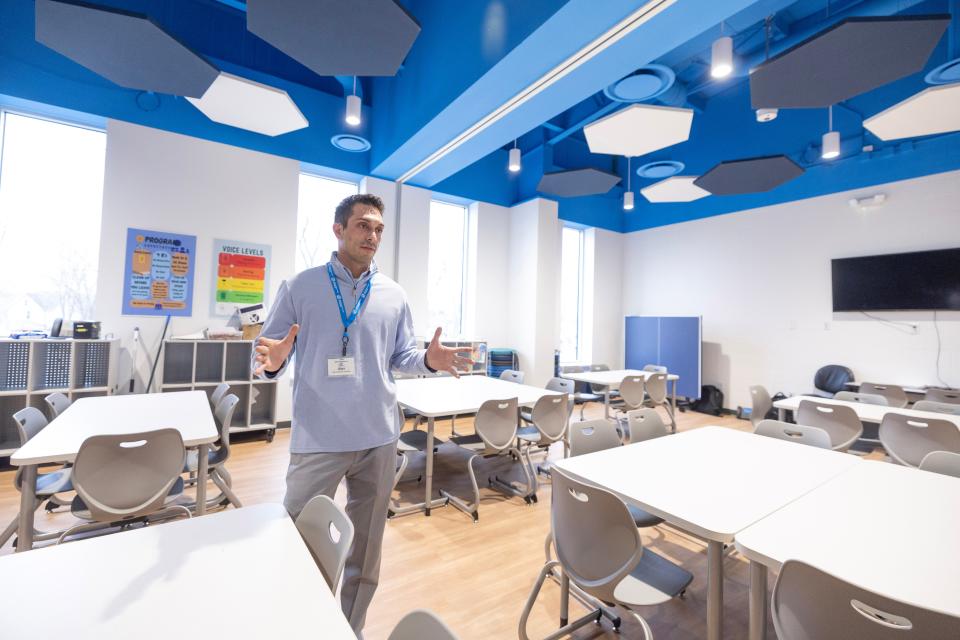 Alex Williamson, assistant director of the Boys & Girls Club of Massillon, talks about the larger space in classrooms at the center's new building, 730 Duncan St. SW.